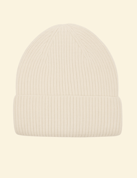 A cream-colored ribbed knit beanie made from a cozy cashmere-wool blend, displayed on a neutral background.