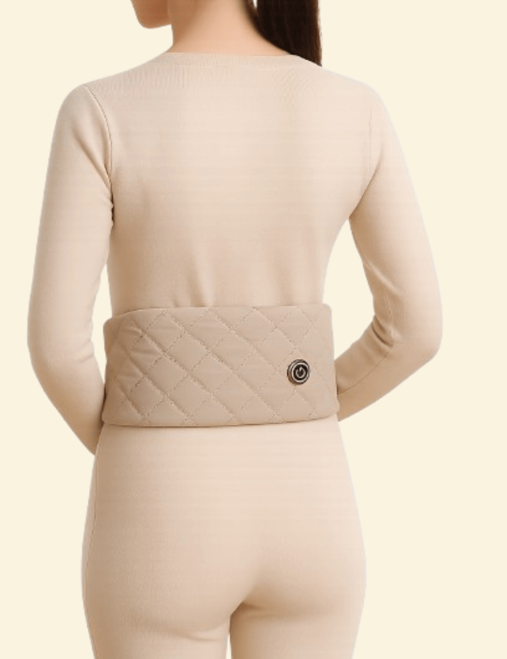Rear view of a woman wearing the Warmweave heated scarf around her waist, showing its versatile use for back warmth and comfort.