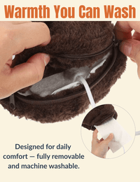 Close-up of the removable inner heating pad being taken out of a Warmweave™ heated slipper, showcasing the zippered compartment and soft fleece interior. Caption highlights that it's fully machine washable for daily comfort and easy care.