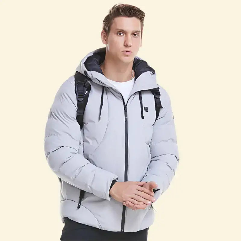 Man wearing USB heated parka in light grey with front zipper and backpack