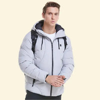 Man wearing USB heated parka in light grey with front zipper and backpack