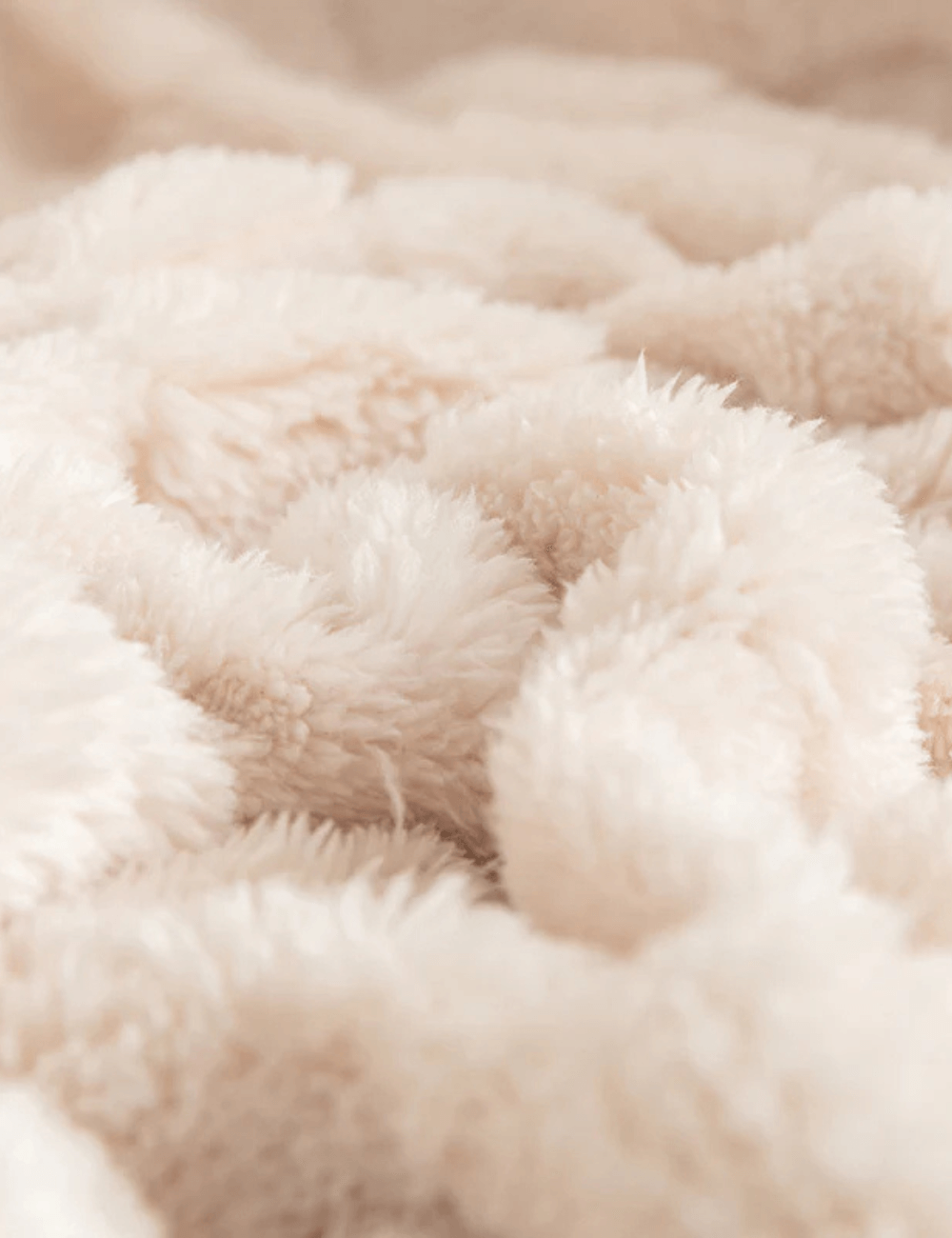 Detailed view of the soft checkered texture of the Warmweave blanket