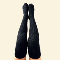 Pair of black Warmweave™ knee-high socks side by side on a neutral backdrop