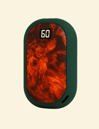 Front view of the EmberGlow hand warmer with a green casing and glowing ember surface, displaying 60°C.
