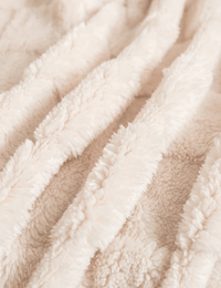 Plush and fluffy material close-up of the Warmweave sofa blanket