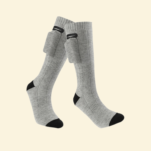 Grey heated socks displayed with visible battery connectors, showcasing side view and material texture