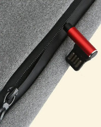 USB port detail of the Warmweave™ Heated Sweatshirt for easy plug-in heating via power bank
