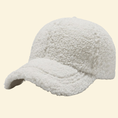A crisp white wool-lined baseball cap in Snowdrift, offering clean winter style with plush insulation for cold days.



