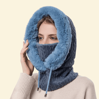 Model wearing plush navy blue hooded scarf with thermal knit lining