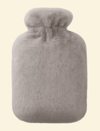 Grey Warmweave™ hot water bottle in plush flannel cover, designed for leak-resistant, long-lasting warmth.