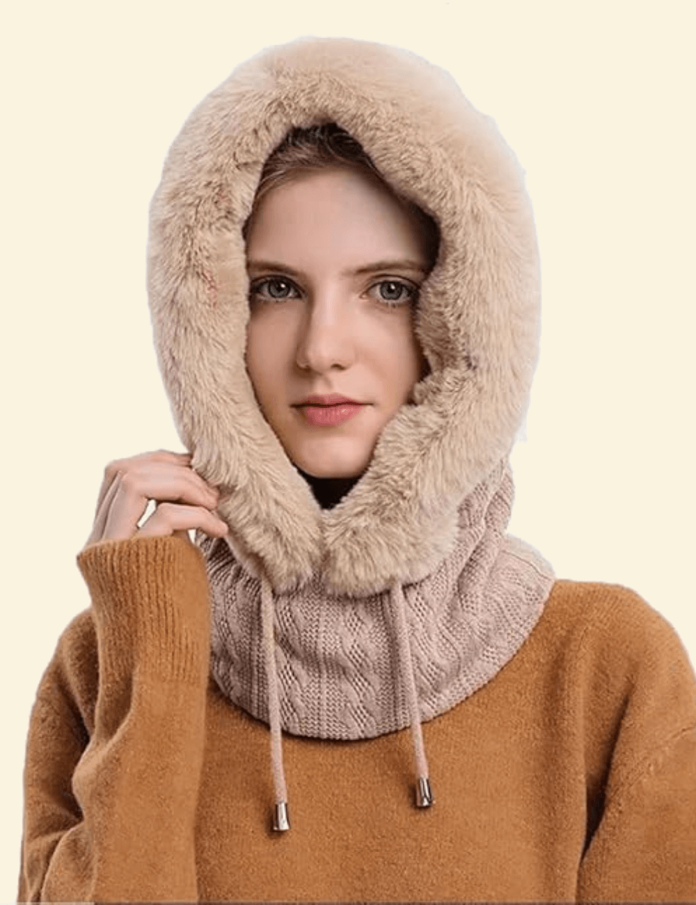 Model wearing beige faux fur hooded scarf with ribbed knit neck and cozy brown sweater, front-facing winter look