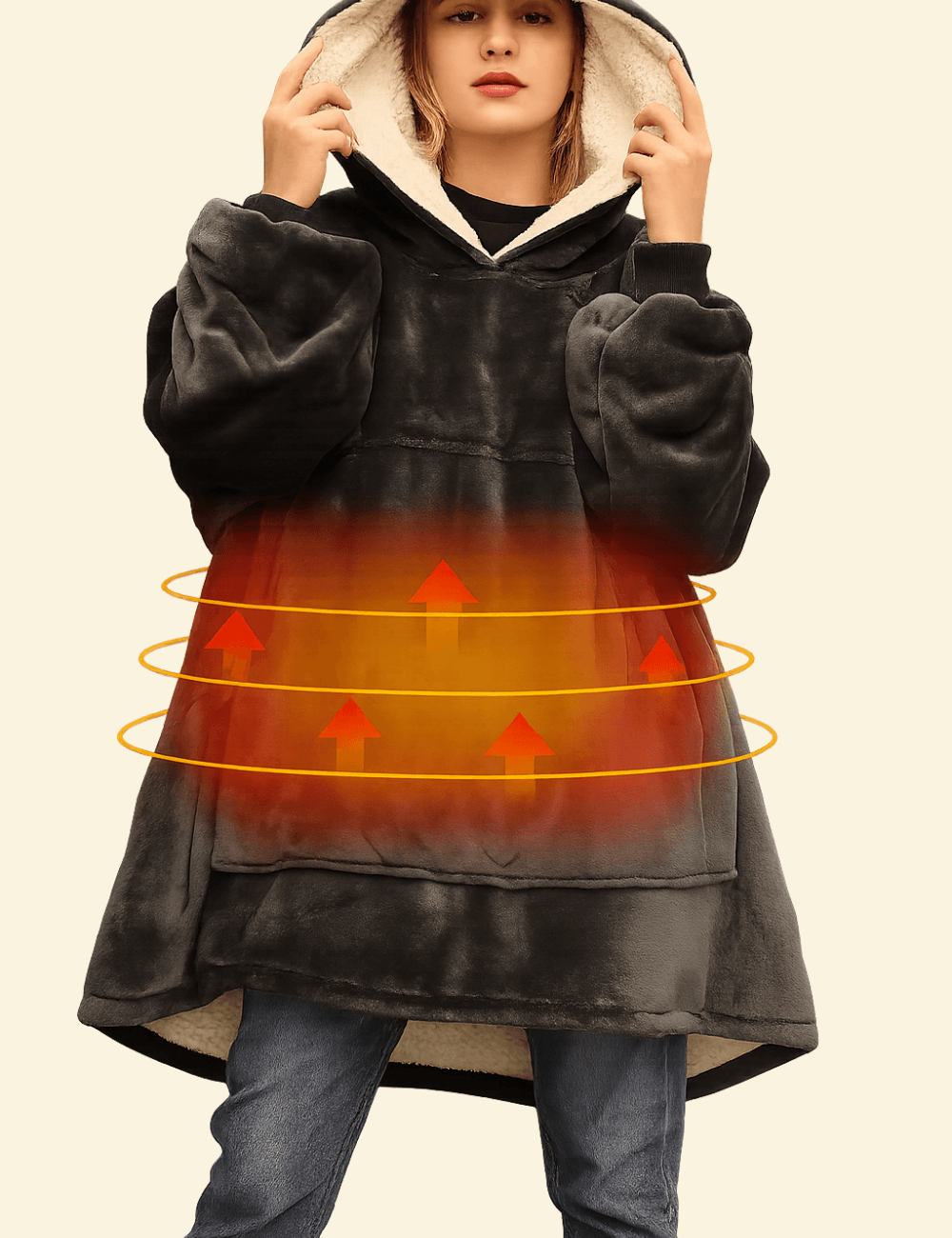 Model wearing the Warmweave™ USB Heated Oversized Hoodie Blanket in Charcoal Night with visible heating zone glow and sherpa-lined hood