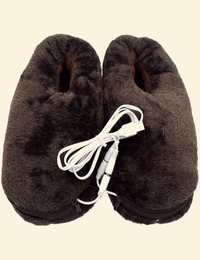 Close-up of Warmweave™ USB Heated Slippers in brown, featuring a soft fleece exterior and USB charging cable at the center. Designed for warmth, comfort, and easy USB-powered heating.

