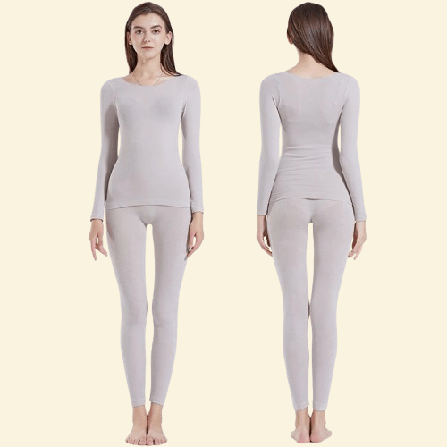 Woman wearing Warmweave™ light grey thermal underwear set, front and back view

