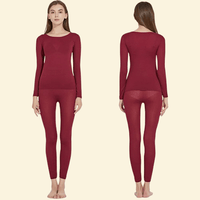 Woman wearing Warmweave™ red thermal underwear set, shown from front and back

